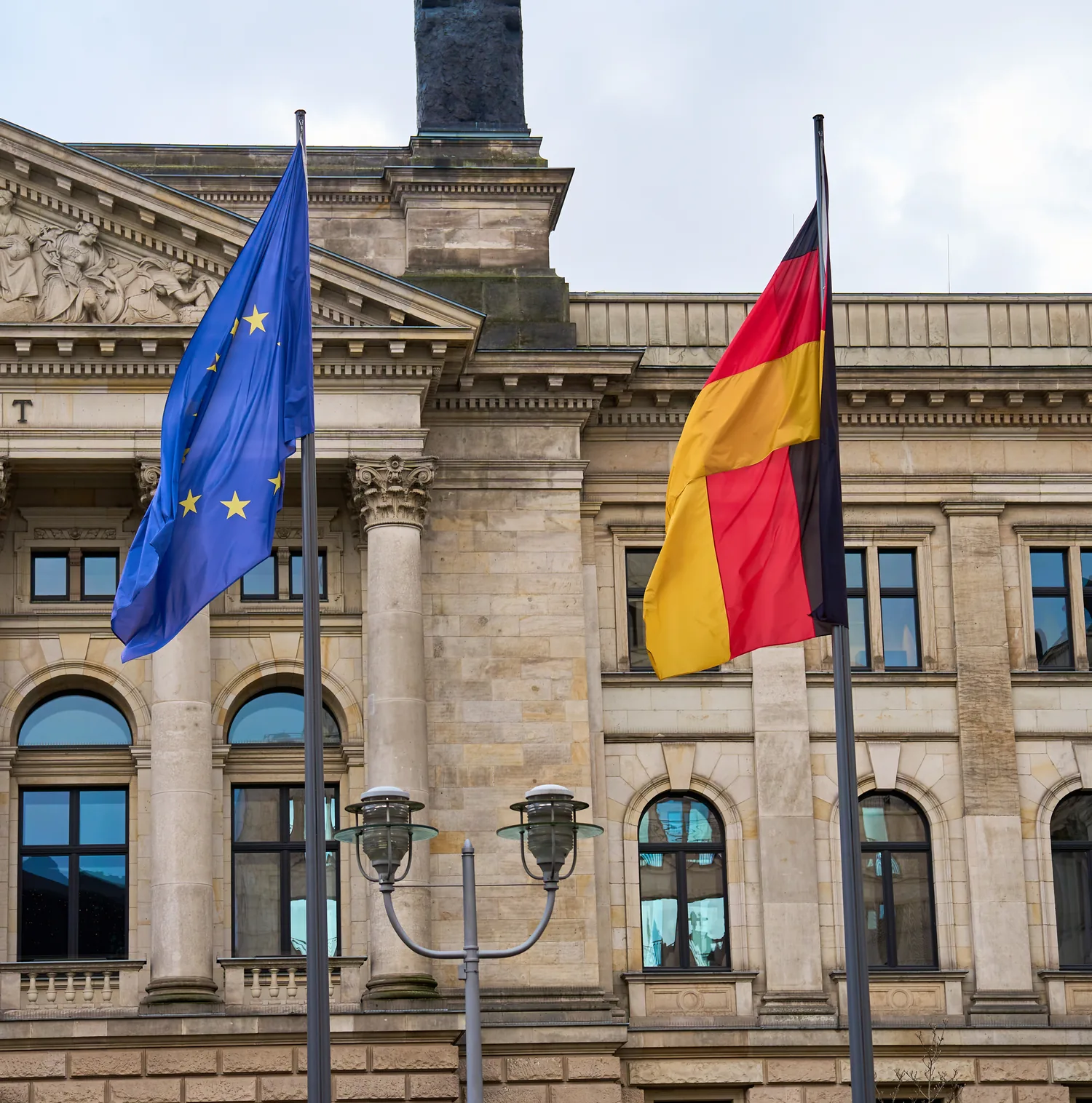 The European and German flags in front of the Bundesrat building in Berlin